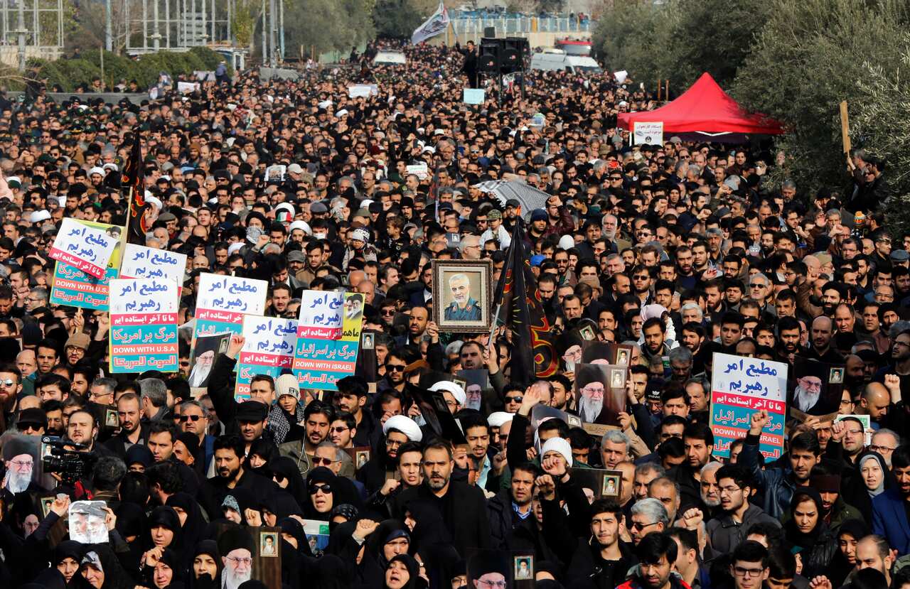 Thousands of Iranians take to the streets to mourn the death of commander of the Quds Force Qasem Soleimani.