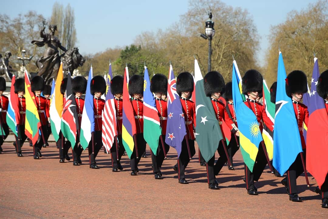 Coldstream Guards carrying flags of 53 Commonwealth countries.