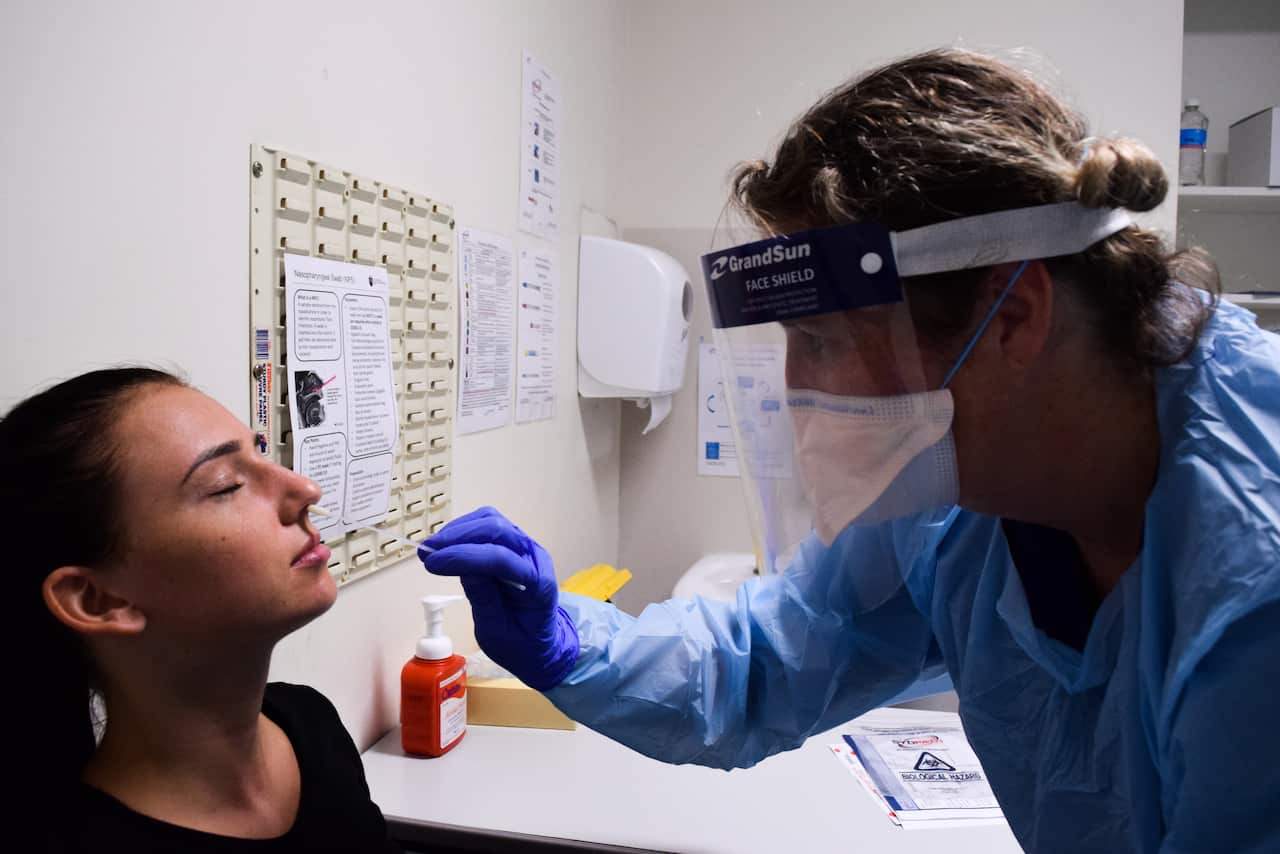 A woman is tested for COVID-19 at St Vincent's Hospital in Sydney.