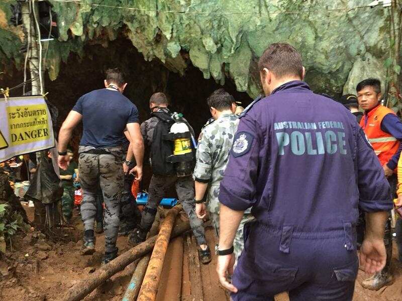 Rescue crews ready themselves to go back into the cave.