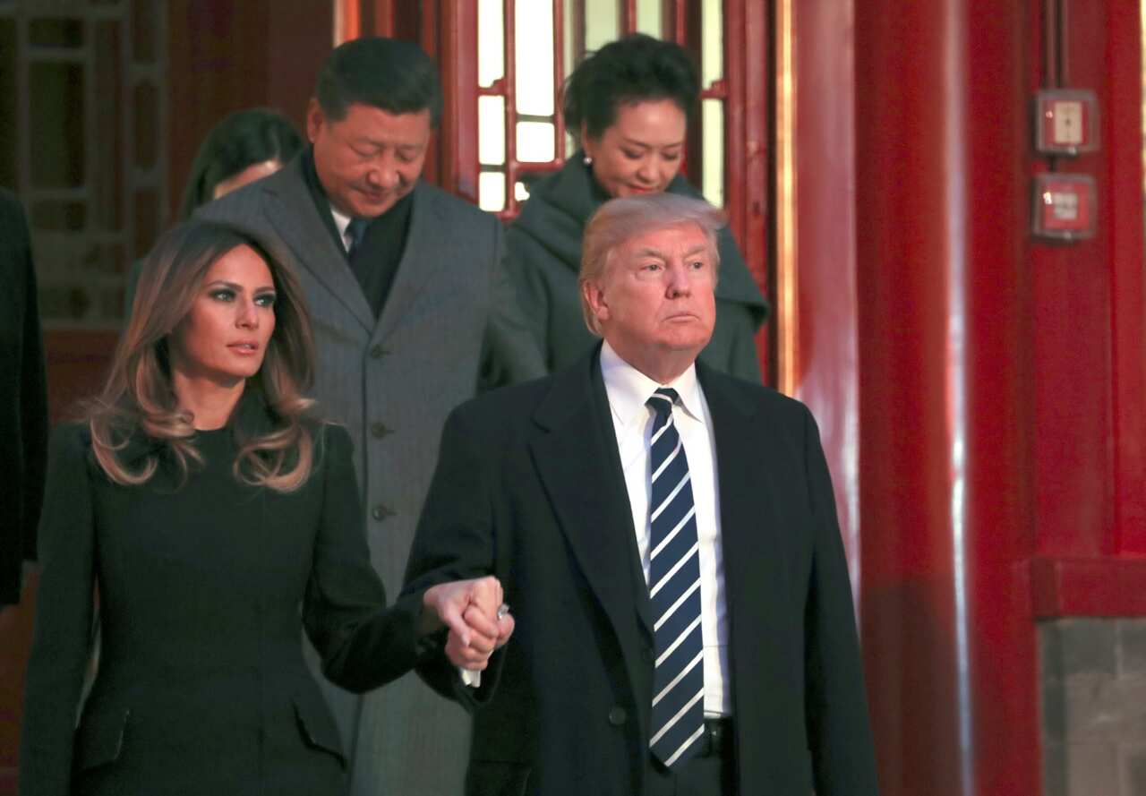 File: US President Donald Trump and first lady Melania Trump arrive with Chinese President Xi Jinping, left back, and Xi's wife Peng Liyuan In November