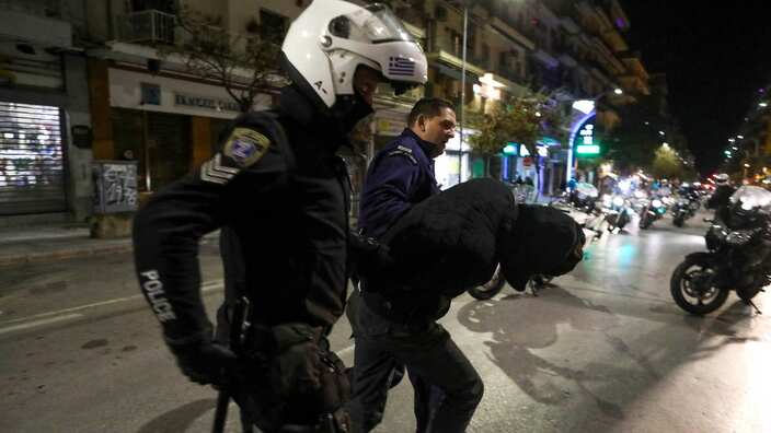 Policemen detain a protester after clashes during a rally marking the 10th anniversary of the killing of teenager Alexis Grigoropoulos by a Greek police officer, in Thessaloniki, Greece, 06 December 2018.