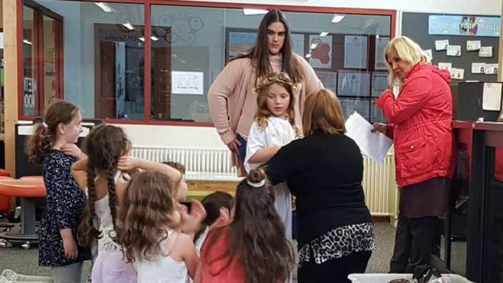 At the play rehearsal. 