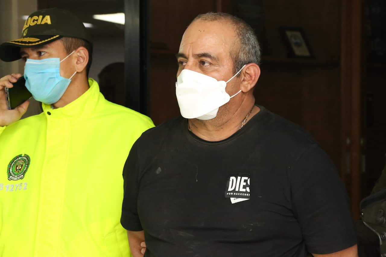 Dairo Antonio Usuga David, aka Otoniel, as authorities bring him in to be booked in Bogota