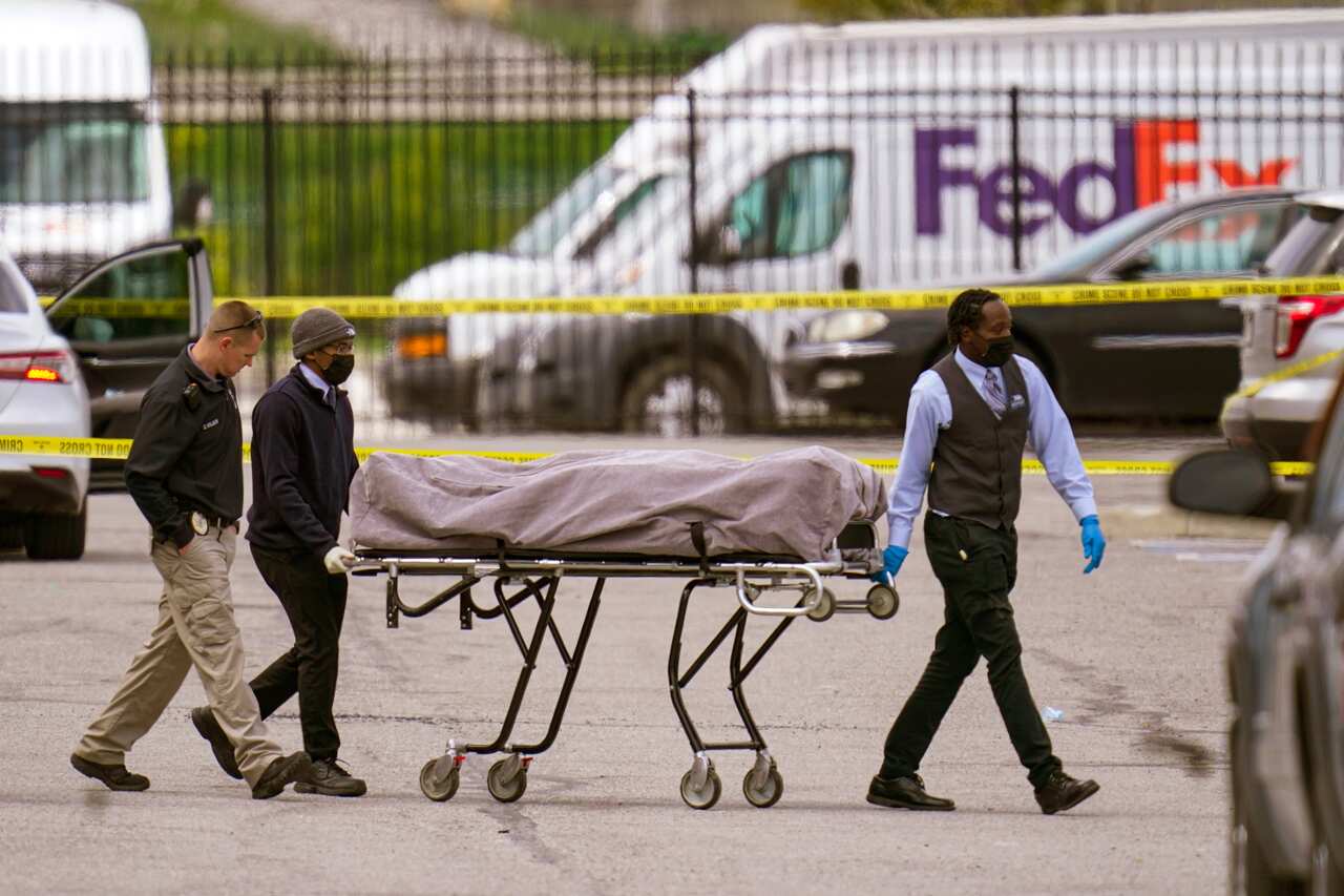 A body is taken from the scene of a shooting at a FedEx Ground facility in Indianapolis, Friday, 16 April, 2021. 