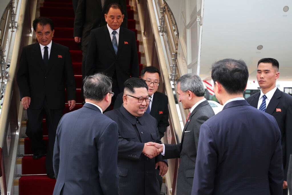 North Korean leader Kim Jong-un (5th from right) welcomed by Singapore's Foreign Minister Vivian Balakrishnan (3rd from Right) at Changi Airport in Singapore.