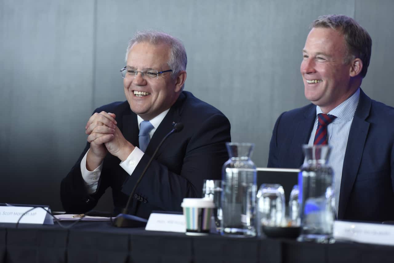 Prime Minister Scott Morrison (left) sits next to then-Premier Will Hodgman at the TAS State Liberal Party Conference last year.