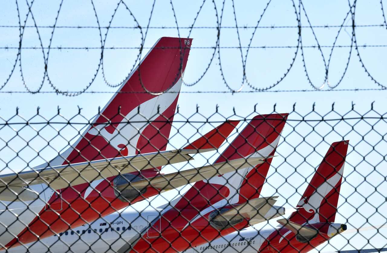 Grounded Qantas aircraft are seen parked at Brisbane Airport in Brisbane.