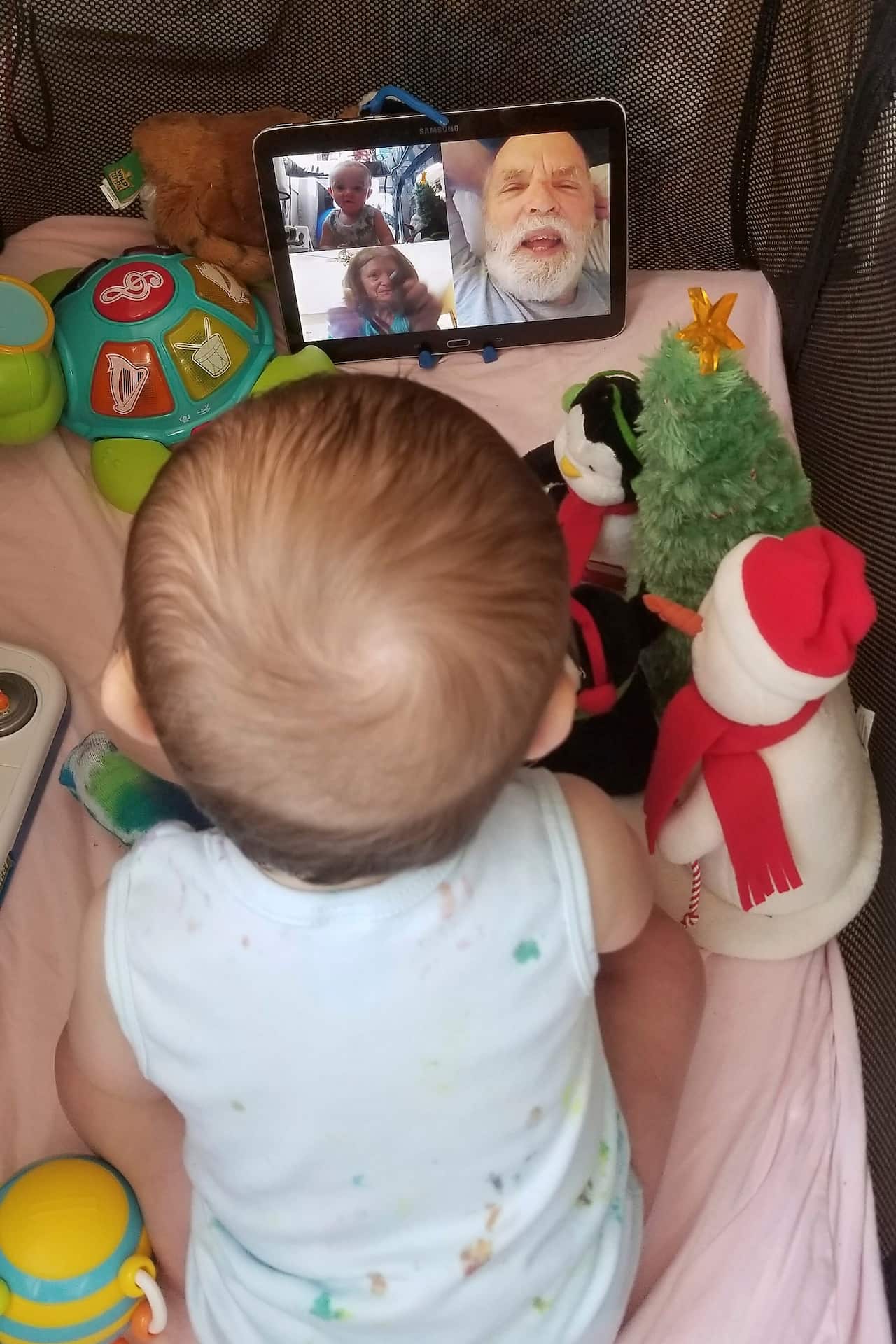 7-month-old Calvin, interacts with his grandparents on a FaceTime video call