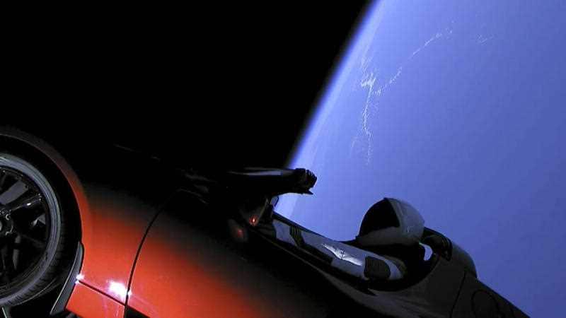 This image from video provided by SpaceX shows the company's spacesuit in Elon Musk's red Tesla sports car which was launched into space during the first test flight of the Falcon Heavy rocket on Tuesday, February 6, 2018.
