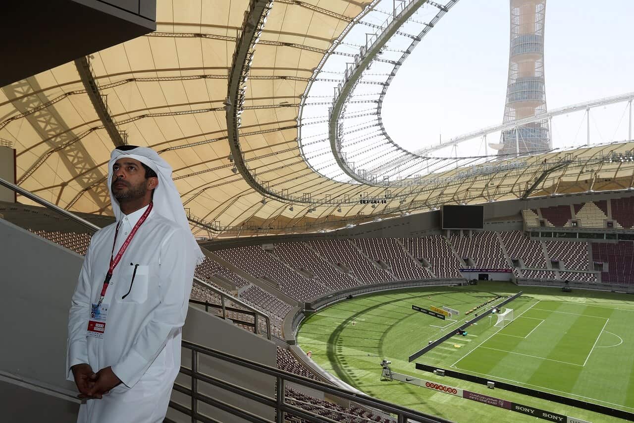 Nasser Al-Khater speaks to journalists during a tour of the Khalifa International Stadium in Doha.
