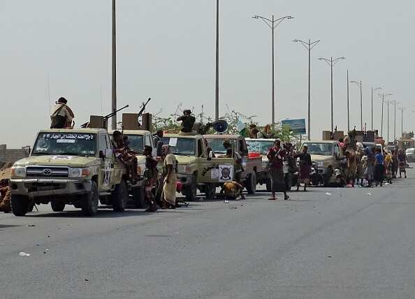 Yemeni pro-government forces gather on a highway on the eastern outskirts of Hodeida.