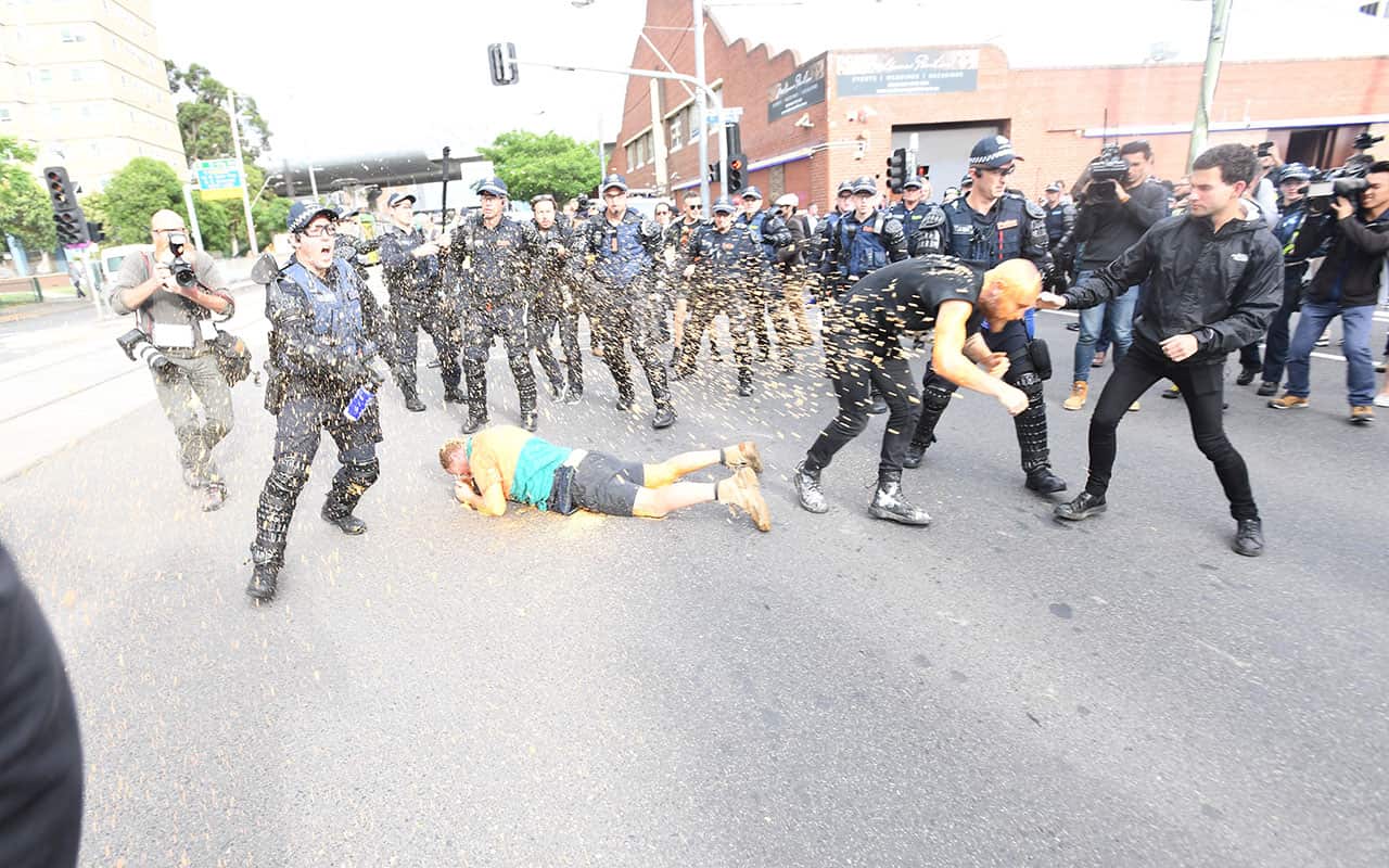 Protesters clash police in Kensington, Melbourne on Monday, December 4, 2017.