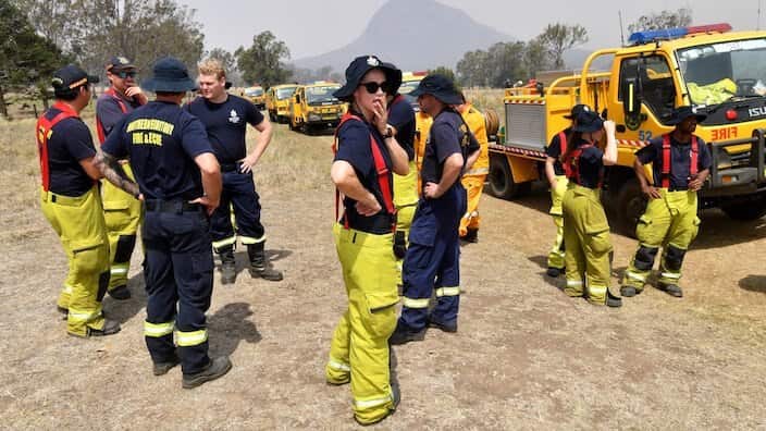 Rural firefighters are seen preparing to fight fires at Spicers Gap, south west of Brisbane, Wednesday, November 13, 2019. A number of homes have been destroyed by bushfires in New South Wales and Queensland. (AAP Image/Darren England) NO ARCHIVING 
