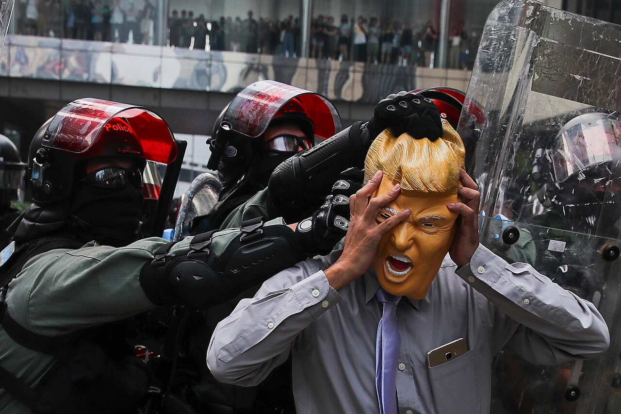 An anti-government protester uses an US president Donald Trump mask during a Global Anti Totalitarianism Rally in Hong Kong.