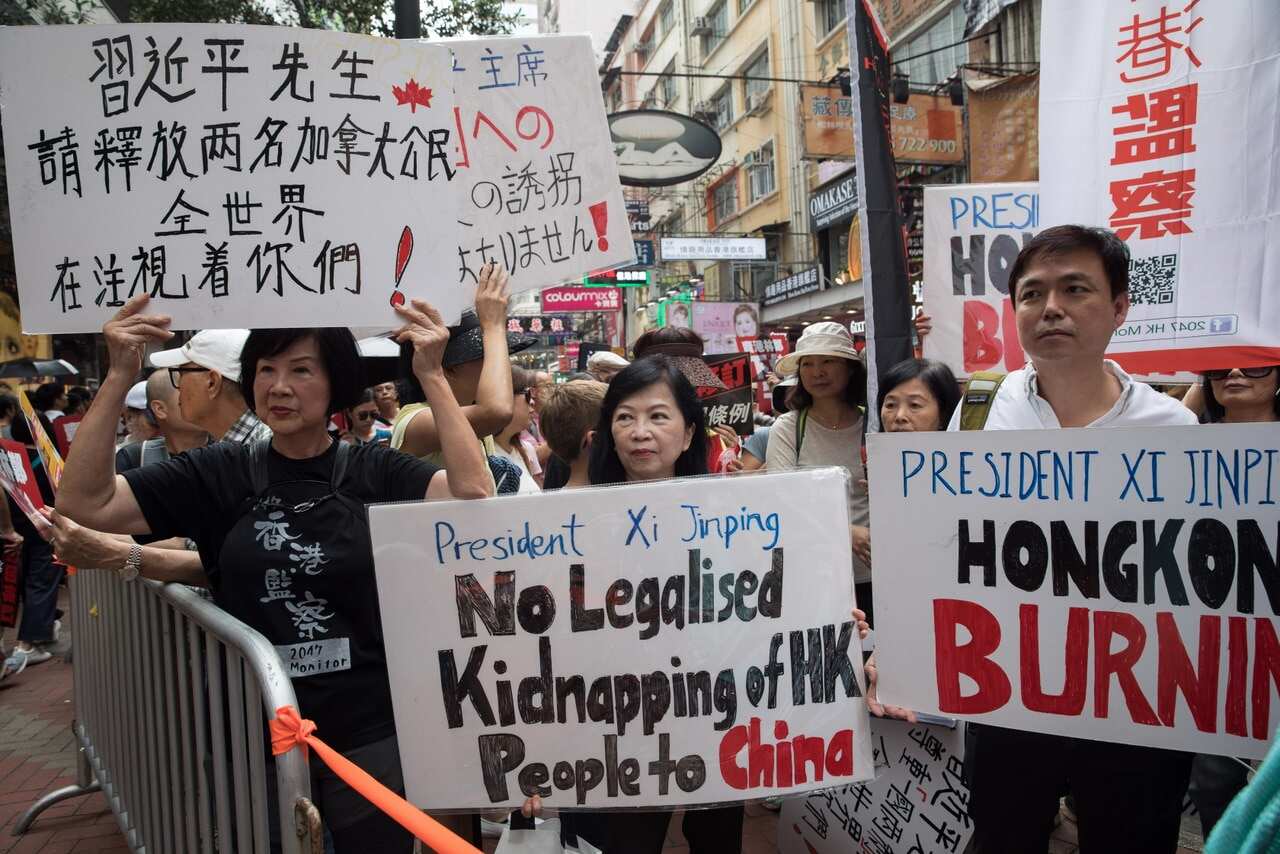 Pro-democracy activists take part in a march against a proposed extradition law in Hong Kong.