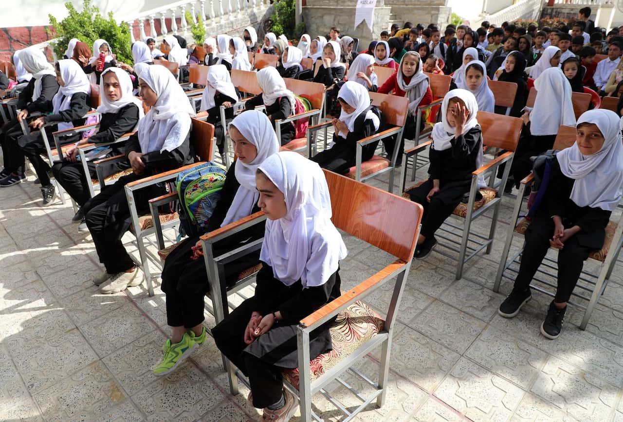 Girl students are seen in the schoolyard in Kabul, Afghanistan on March 22