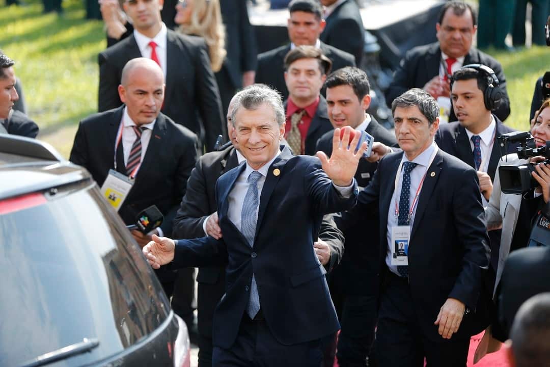 Argentina's President Mauricio Macri waves after Paraguay's new President Mario Abdo Benitez's inauguration ceremony at "Lopez Palace" in Asuncion, Paraguay, Wednesday, Aug. 15, 2018. (AP Photo/Jorge Saenz)