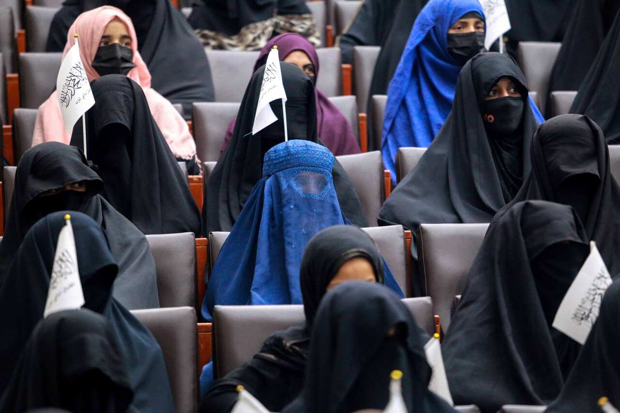 Afghan students listen to women speakers prior to their pro-Taliban rally outside the Shaheed Rabbani Education University in Kabul, on 11 September, 2021.