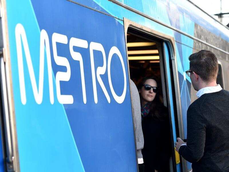 Peak hour commuters cram into a city loop train