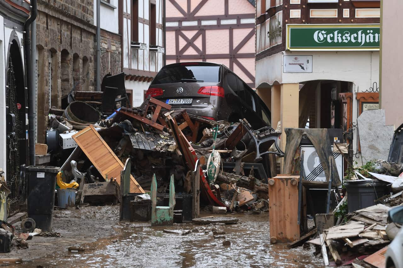 Debris and a damaged car pile up in a street in Bad Neuenahr-Ahrweiler, western Germany, on 16 July, 2021.
