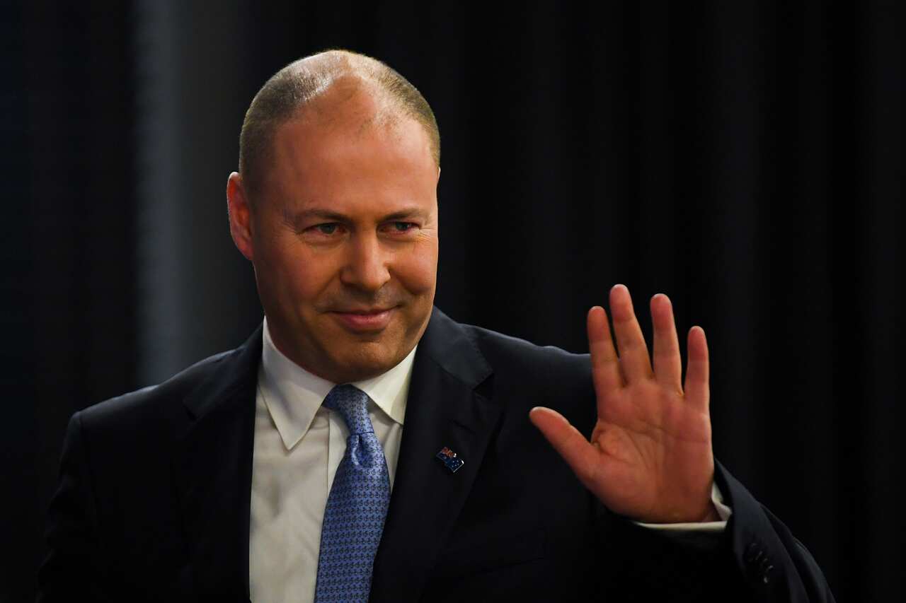 Treasurer Josh Frydenberg reacts ahead of delivering a 2020 Post-Budget Address to the National Press Club in Canberra, Wednesday, October 7, 2020. (AAP Image/Lukas Coch) NO ARCHIVING