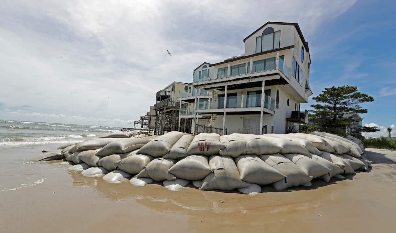 Sand bags surround homes on North Topsail Beach, N.C., Wednesday, Sept. 12, 2018, as Hurricane Florence threatens the coast.