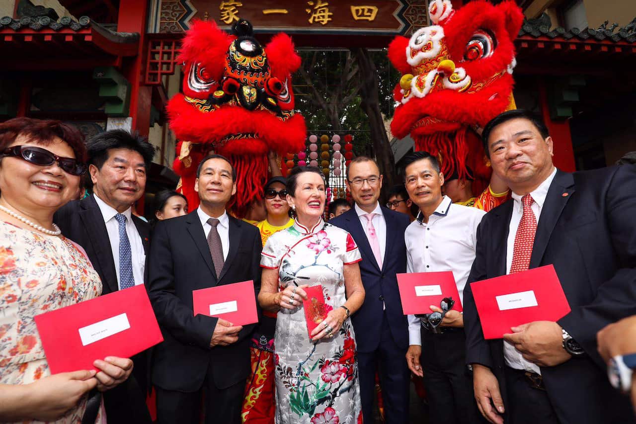 Sydney Lord Mayor Clover Moore has celebrated the New Year with lion dancers and handed out traditional lucky red packets in Chinatown.