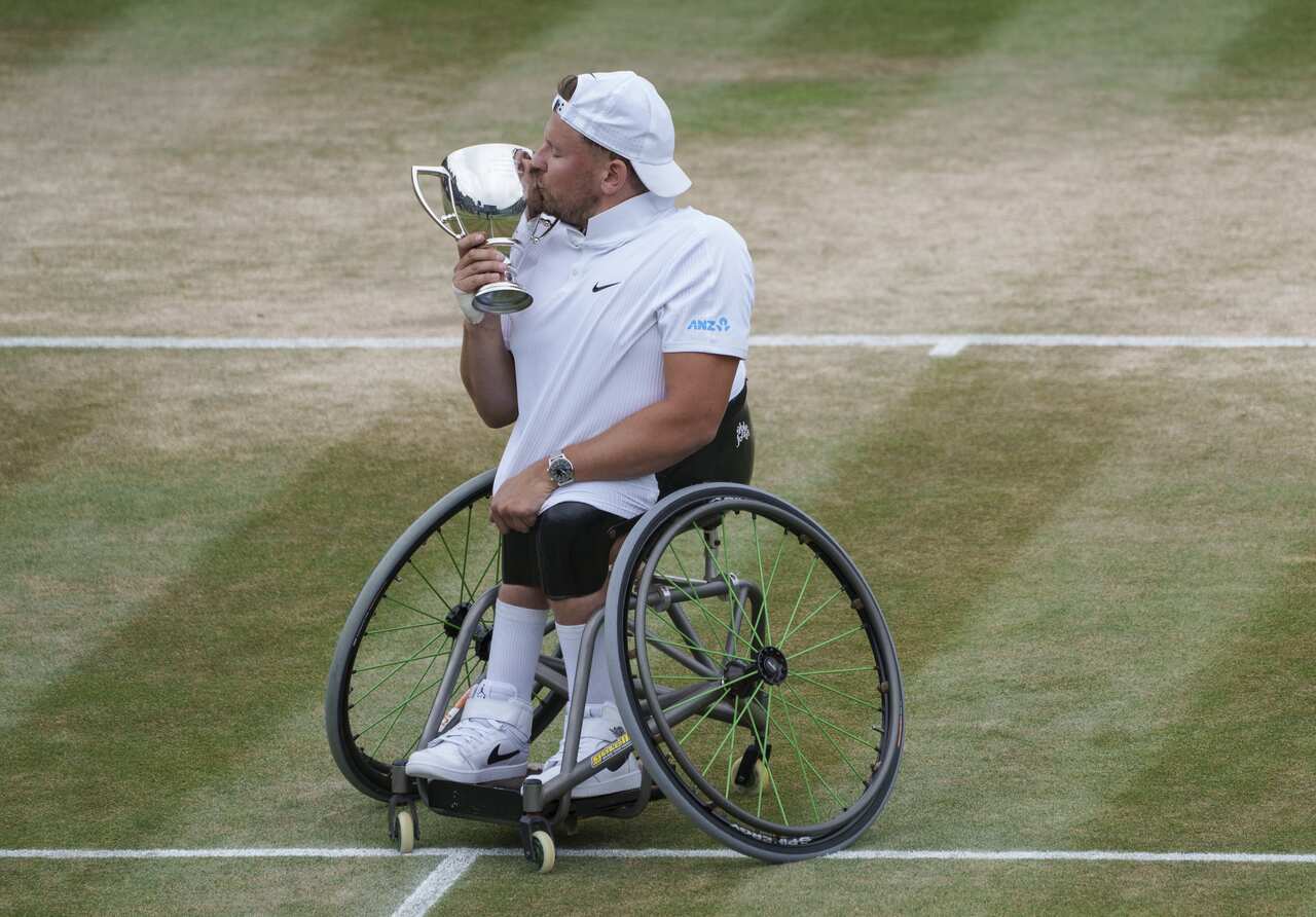 Dylan Alcott with the winners trophy after winning the final of the quad wheelchair singles