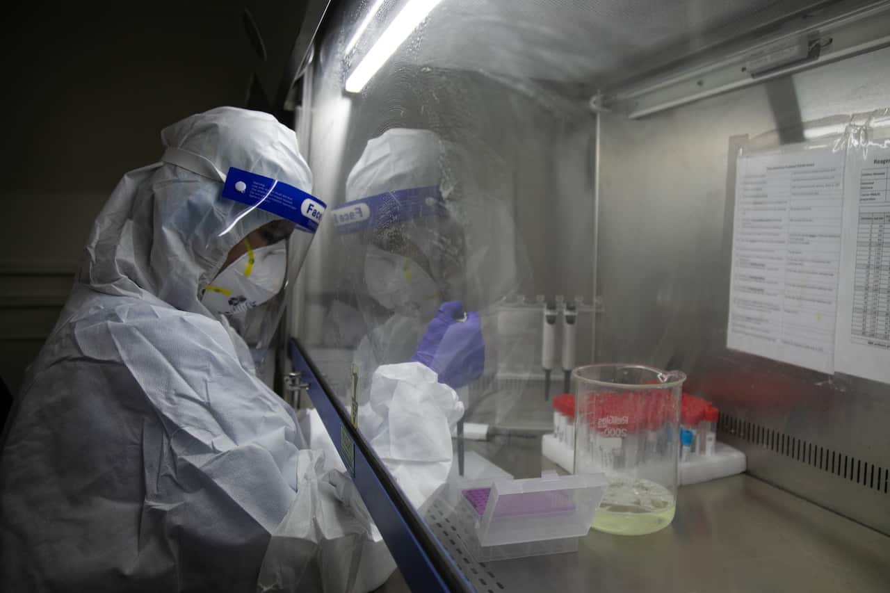 A laboratory technologist processes COVID-19 samples at the Bidh Lab in Nepal where oversea coronavirus variants have been recorded.