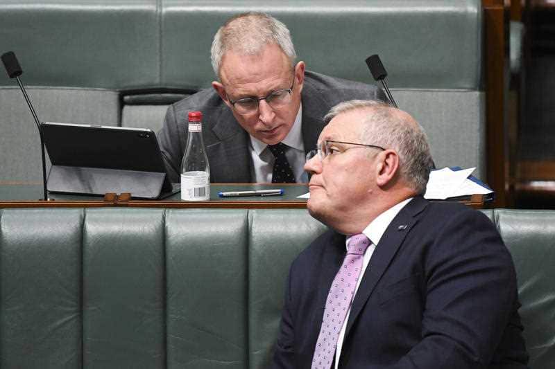 Prime Minister Scott Morrison speaks to Communications Minister Paul Fletcher during House of Representatives Question Time, Thursday, October 22, 2020.