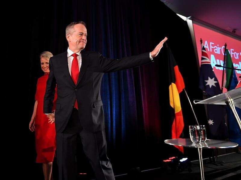 Bill Shorten leaves with wife Chloe after conceding defeat.