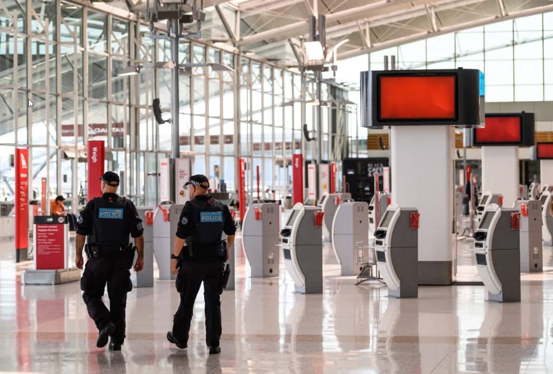 Police Officers patrolling in the Departures Hall of Sydney Domestic Airport.
