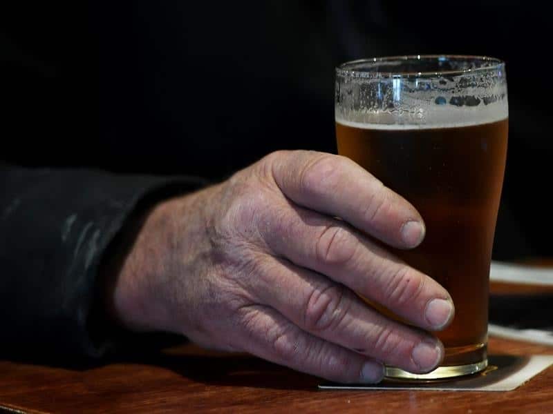 A Patron drinking an Australian beer.