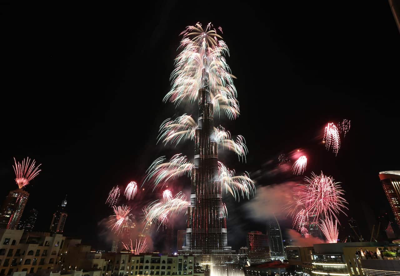Fireworks explode from the Burj Khalifa, the world's tallest tower, in Dubai (AAP)