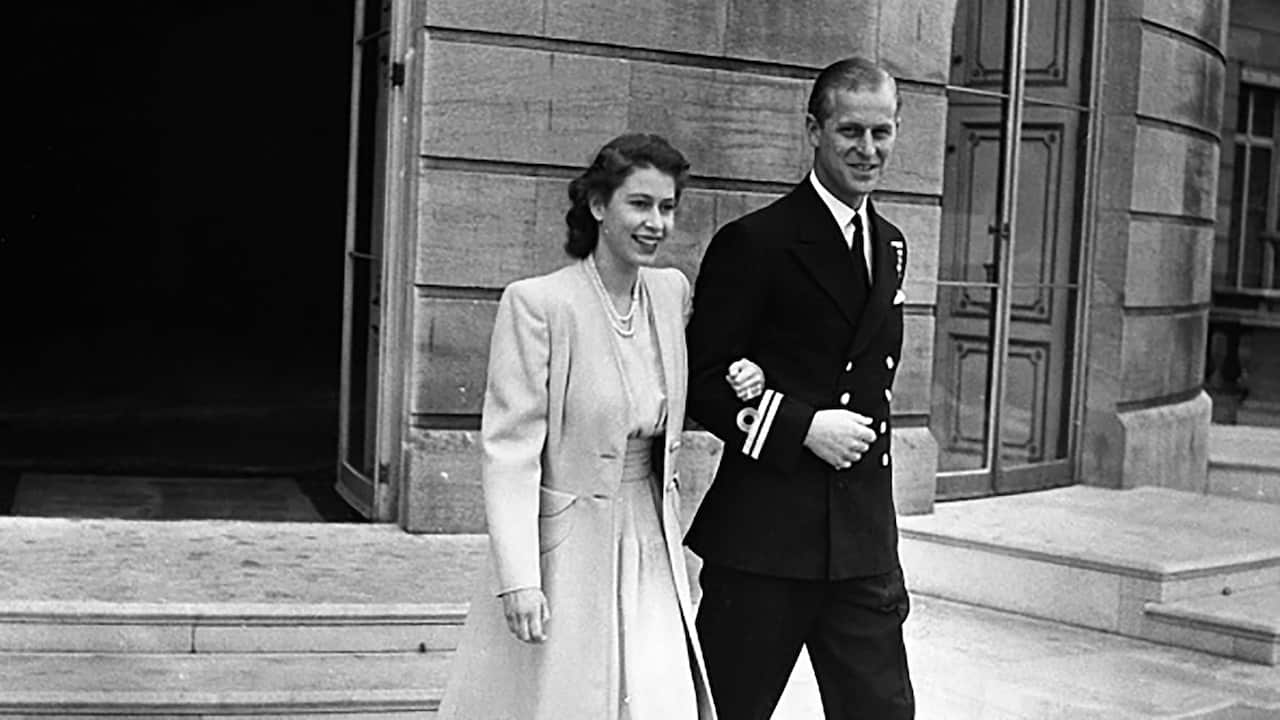 Princess Elizabeth with her fiancee, Lieutenant Phillip Mountbatten at Buckingham Palace after the announcement of their engagement by her father the King. (Photo by © Hulton-Deutsch Collection/CORBIS/Corbis via Getty Images)