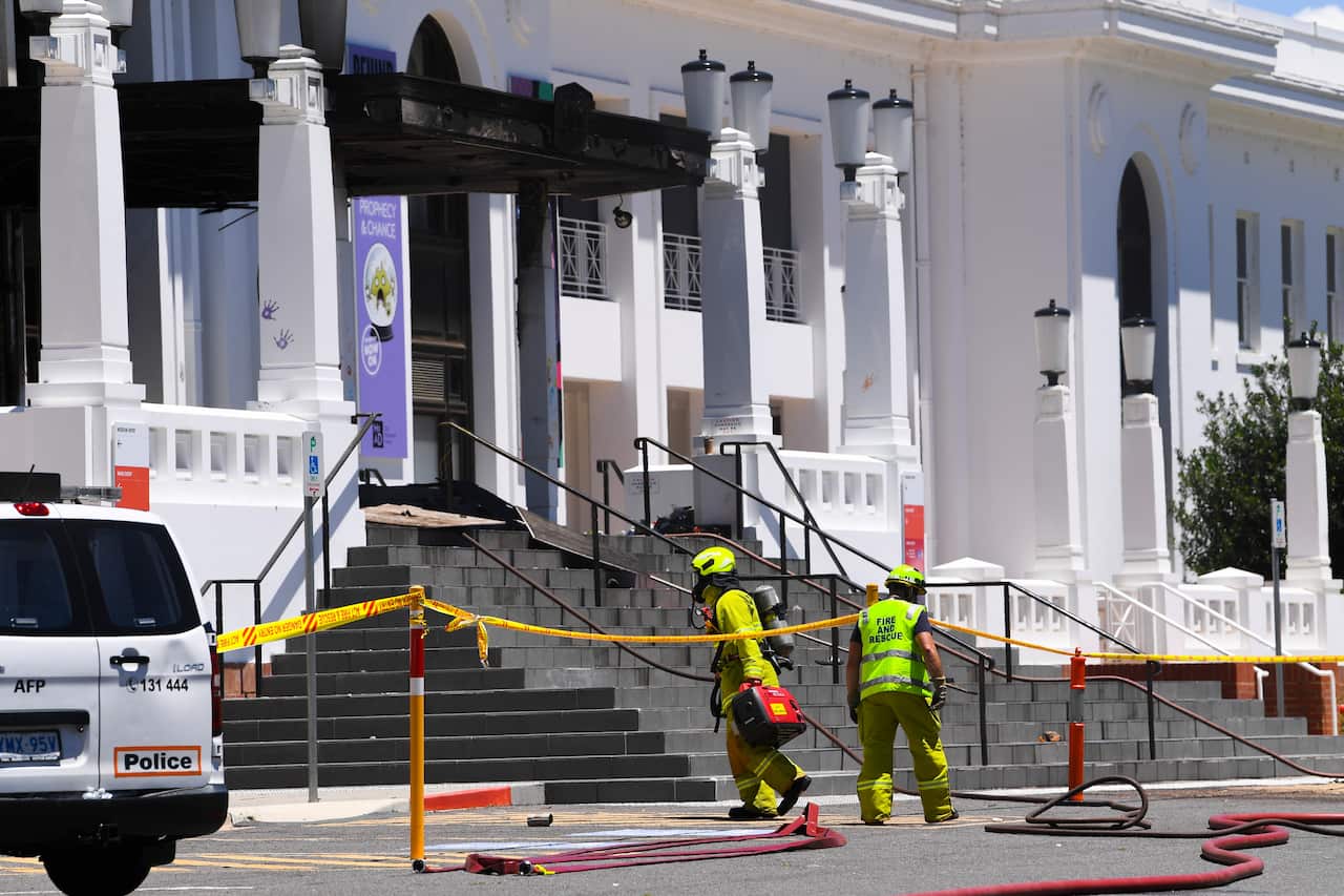 Fire fighters are seen entering the fire damaged entrance to Old Parliament House in Canberra, Thursday, December 30, 2021. (AAP Image/Lukas Coch) NO ARCHIVING