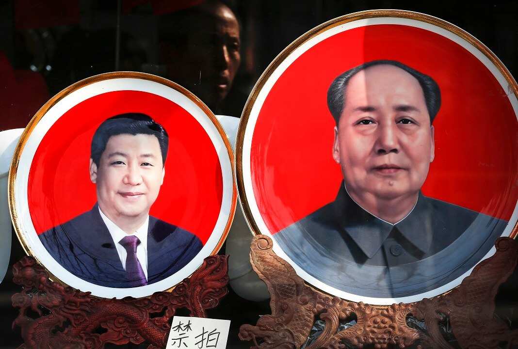 Souvenir plates bearing images of Xi Jinping and Mao Zedong are displayed at a shop near Tiananmen Square in Beijing. 