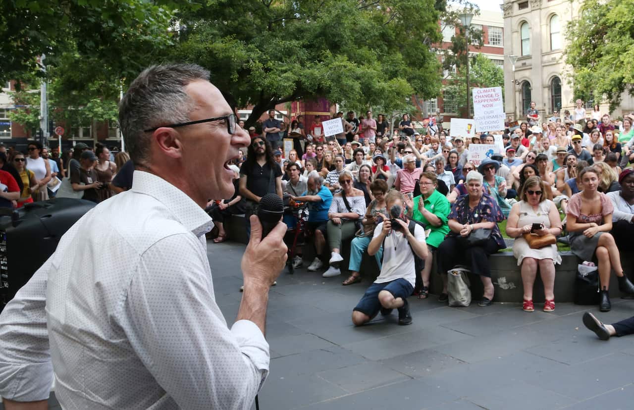 Senator Richard Di Natale addresses climate protesters gathered in front of the State Library of Victoria.