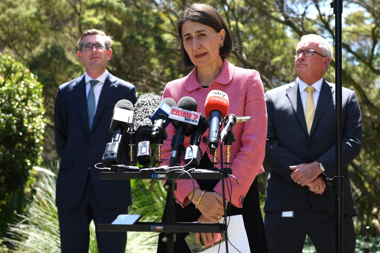 NSW Premier Gladys Berejiklian along with Treasurer Dominic Perrottet (left) and Health Minister Brad Hazzard address media at NSW State Parliament, in Sydney, Tuesday, October 13, 2020. (AAP Image/Dan Himbrechts) NO ARCHIVING
