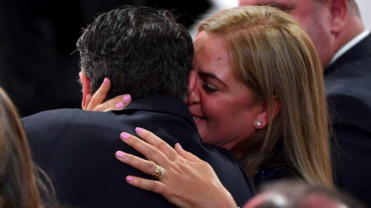 2020 Australian of the Year winner Dr James Muecke is hugged by his wife during the awards ceremony.