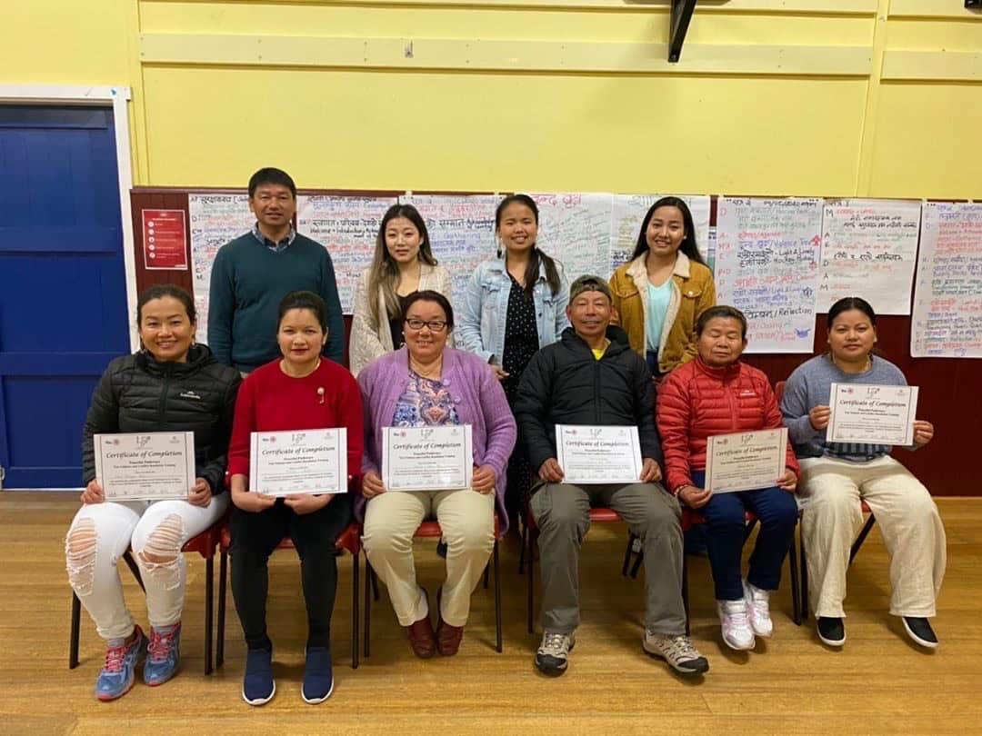 Participants receive their graduate certificate after attending the three-day Alternatives to Violence workshop at Rocherlea, Tasmania.