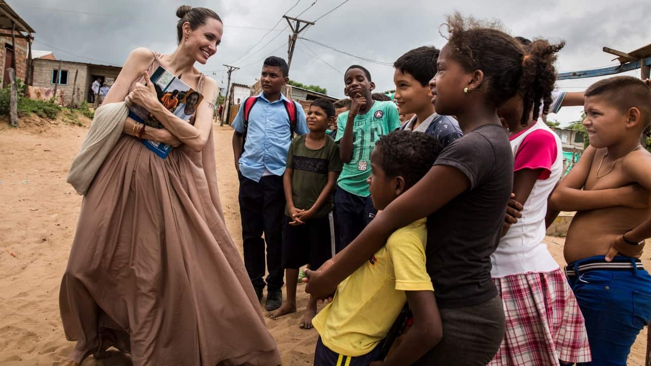 Angelina Jolie speaking with children, who fled Venezuela, in Riohacha, Colombia.