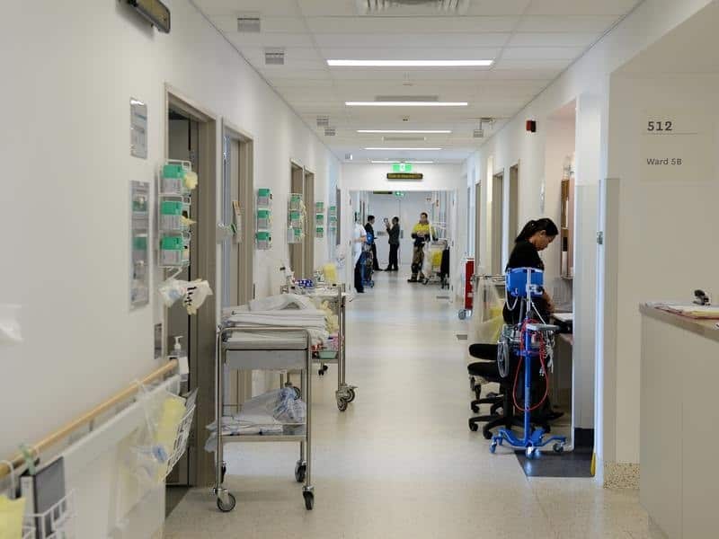 Hospital corridor with staff and equipment