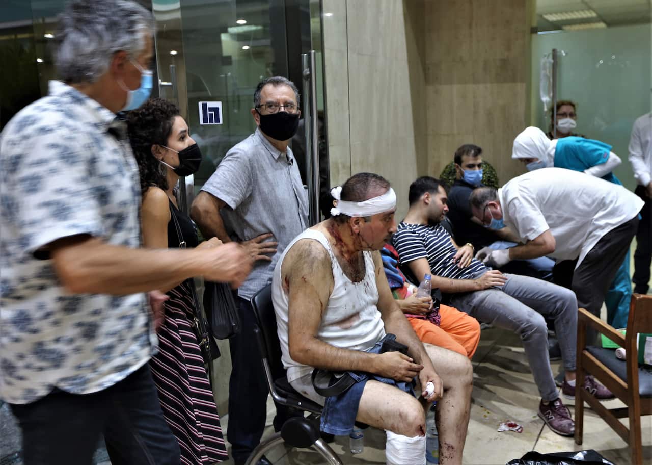 People injured in the Beirut Port explosion receive first aid at Najjar Hospital in Al-Hamra area in Beirut, Lebanon.