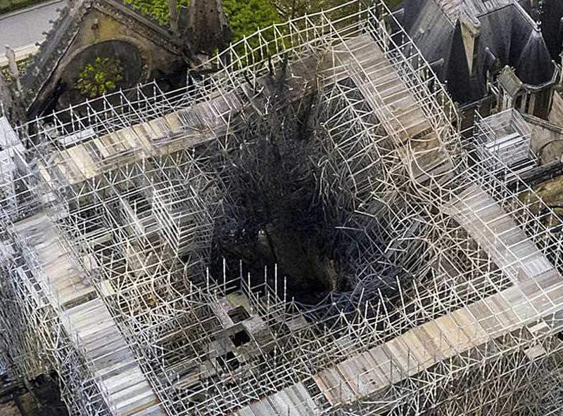 The fire damage to the area where the spire once was. 