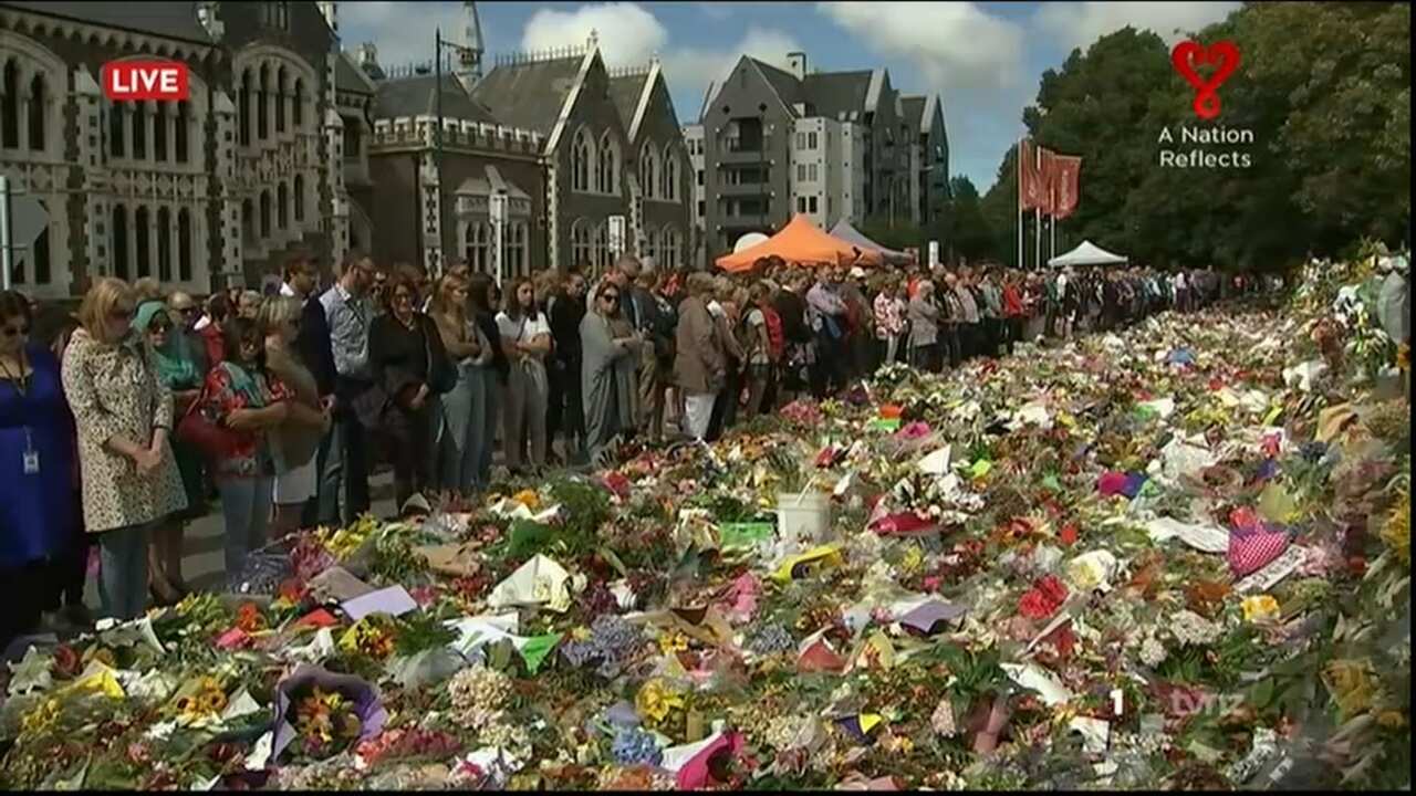 Mourners gather for two minutes silence to remember those who died. 