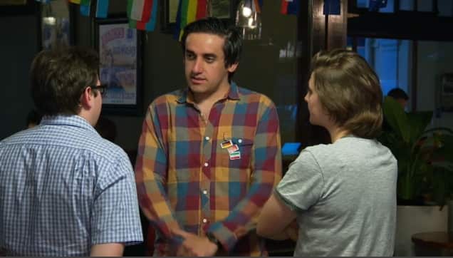 Alex Askari speaks to others at the Language Exchange.