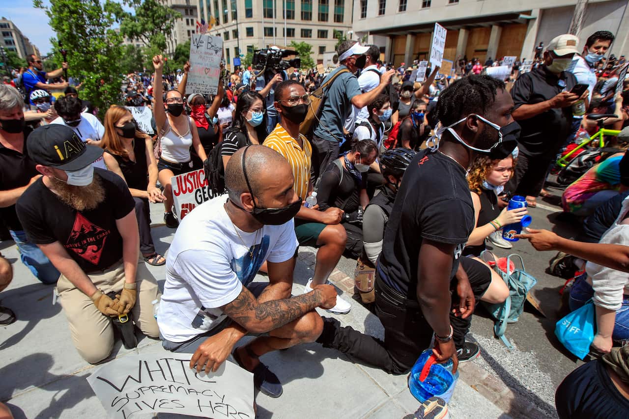Demonstrators protest the death of George Floyd,  near the White House in Washington. 