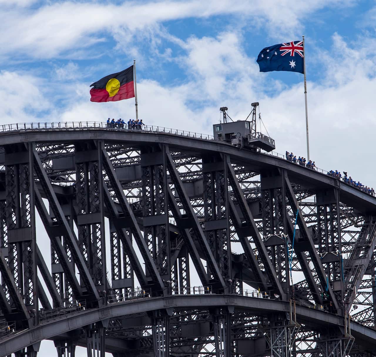 The Australian and the Aboriginal flags on top of the Sydney Harbour Bridge.
